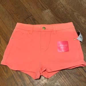 Bright orange high rise shorts